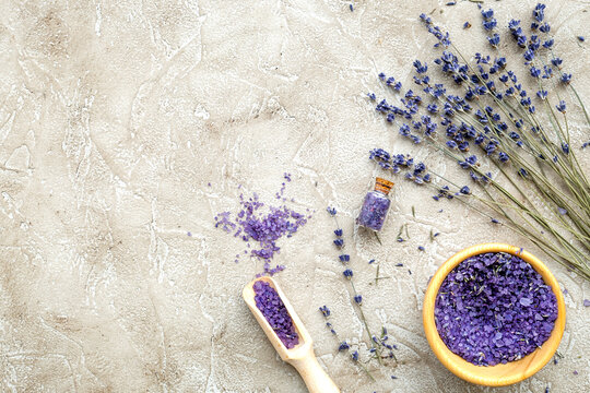 Essential oil and lavender salt with flowers top view