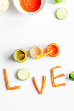 cooking vegetable puree for baby on white background top view