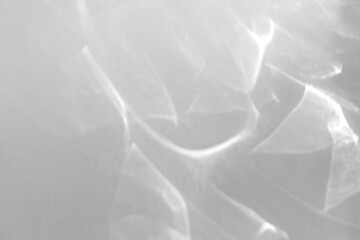 Fototapeta premium Real dense caustic ripple shadow cut out on a transparent png background with soft diffused wavy edges. Lives in a serene wellness scene overlay, surreal and psychedelic design as a transparent png.