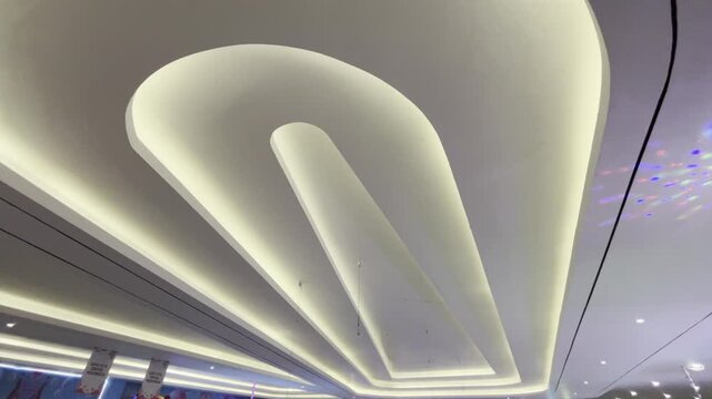 Futuristic Multi Tier Curved Ceiling with Warm and Blue LED Lighting