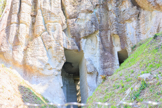 Dramatic Oya Stone Quarry Cliff with Rectangular Quarry Openings in Utsunomiya, Tochigi, Japan