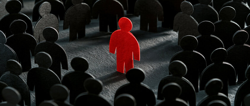 A striking red paper figure stands prominently in the center of a large crowd of identical black paper figures, symbolizing individuality, leadership, and difference in a competitive