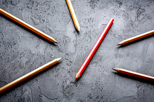 concept selection options with pencils on dark background top view