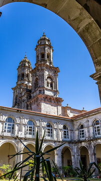 Towers and cloister under blue sky