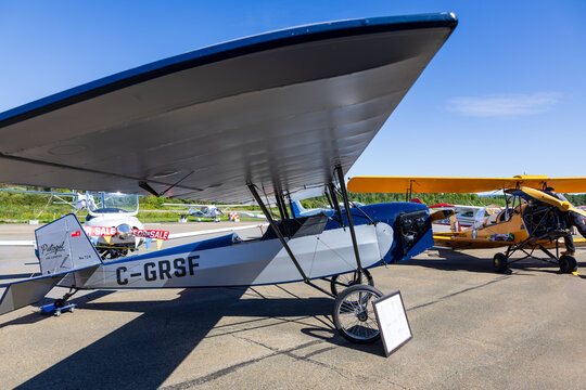 Neuville, Quebec, Canada, August 29, 2026 - Side view of a single seat Pietenpol Air Camper, a parasol wing homebuilt aircraft first designed in the 20s, seen during a public aero club event 