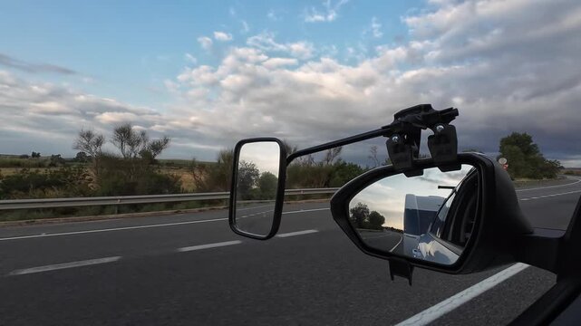 Driving a car towing a caravan in Girona Spain