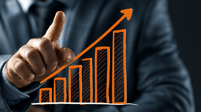 A professional businessman points upward, signifying growth and success. The rising graph in the background represents financial progress and a positive future for companies.