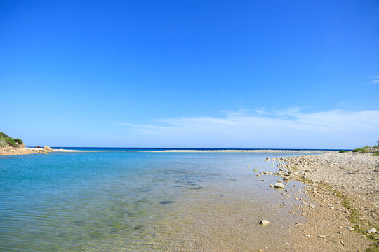 minimalism tranquil peaceful beach landscape with place where river going to the sea