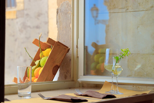 late breakfast of wine aesthetic with fruits vintage calm tranquil atmosphere of Italian restaurant back yard street frame work