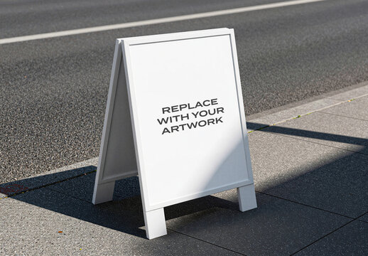 A-frame signboard mockup with blank display surface positioned on a sidewalk beside an asphalt road, realistic outdoor advertising presentation for graphic design, branding