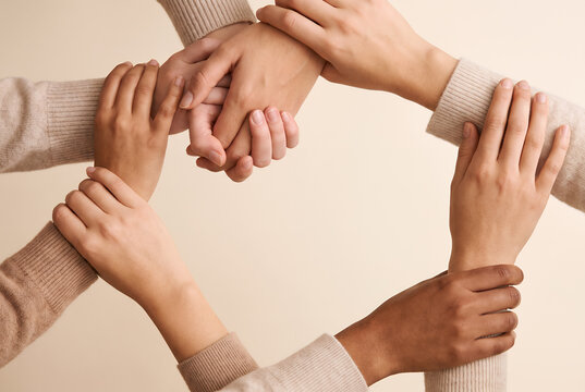 Circle of diverse women hands together unity concept partnership