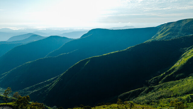 Aerial view of Obudu Mountain Resort with its rolling green hills and lush mountain ranges under a bright sky in Obudu, Cross River, Nigeria.