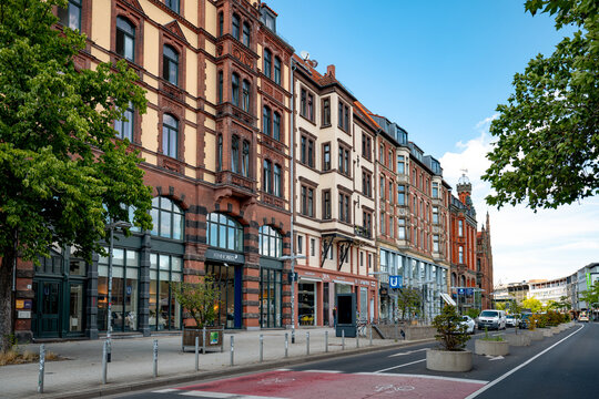 Hanover, Germany - July 1, 2026: Historic residential and commercial buildings line a tree-lined street in Hanover city centre.