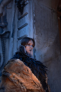 Alternative fashion look on the street, woman in a chain veil looks over her shoulder