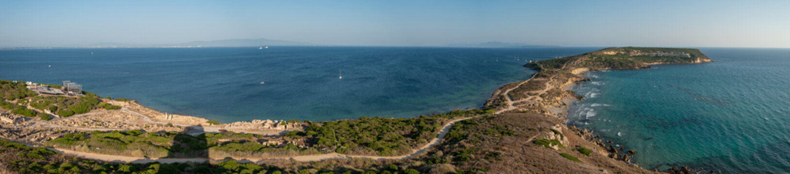 Panorama of the San Giovanni in Sinis promontory, sea view at sunset, in the municipality of Cabras, Italy.