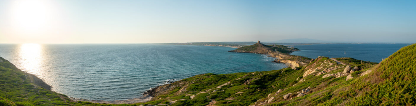 Panorama of the San Giovanni in Sinis promontory, sea view at sunset, in the municipality of Cabras, Italy.