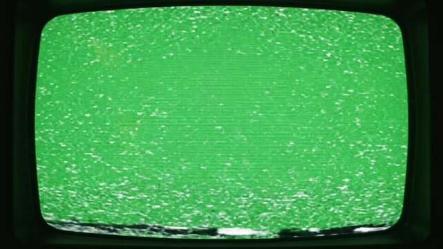 Old green television screen displaying retro vintage static and noise, evoking nostalgia and technological disruption on digital display