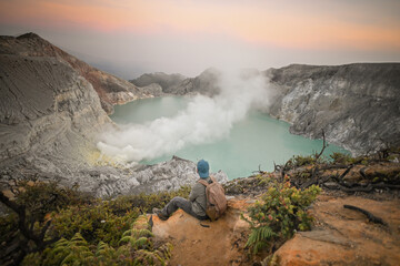Hiking To The Valley Of Sulfur Blue Fire With The View Of Ijen Crater Lake, Ijen UNESCO Global Geopark, East Java, Indonesia. © weniliou