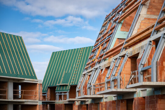Residential apartment block under construction. Red brick shell construction site.
