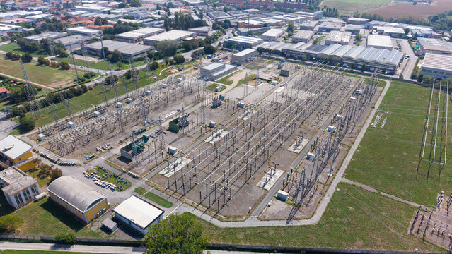 Aerial view of Stazione Elettrica Terna Baggio electrical substation featuring power lines, transformers, and industrial infrastructure in Settimo Milanese, Lombardia, Italy.