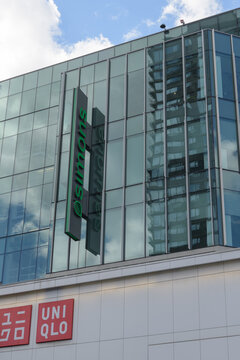 wall mounted projecting sign of Simons, a fashion, apparel, and home goods retailer and Uniqlo, a Japanese retailer, located here at CF Toronto Eaton Centre 
