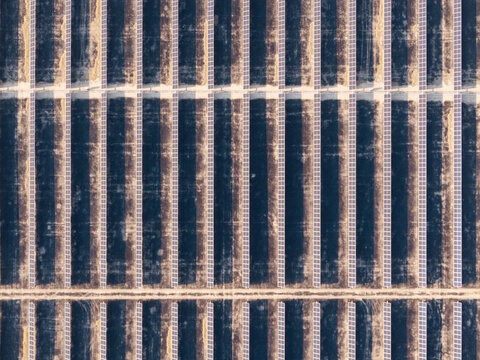 Aerial view of the Arlington solar farm featuring long rows of photovoltaic panels arranged in a grid pattern across the landscape in Arlington, Oregon, United States.