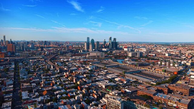 Moving over the vast panorama of New York City, USA. Drone flight over the city approaching the cluster of high-rises.