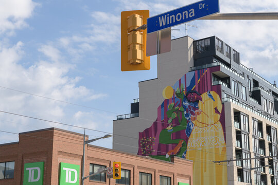 wide, distant view of Yellow Oasis from STEPS Public Art, by Artist Yasaman Mehrsa, at 840 St Clair Av W and TD bank branch at 870 St Clair Av W (at Winona Dr), Toronto