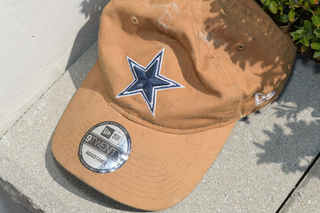 Obraz premium old Dallas Cowboys star logo embroidered on a brown or canvas-colored hat in Toronto