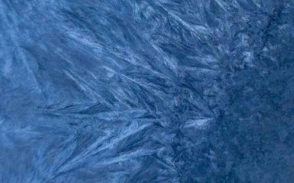 Horizontal deep blue abstract background with crystalline needle frost texture
