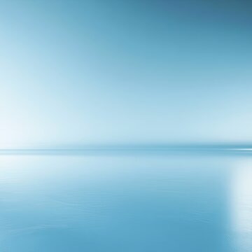 Soft focus of calm blue water meeting a bright, distant horizon line