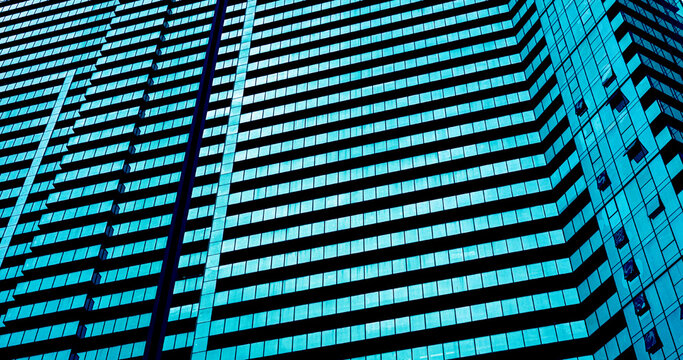 Modern building facade with repeating glass windows pattern