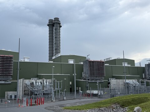 View of Cricket Valley Energy facility with its twin exhaust stacks, air-cooled condenser system, and industrial infrastructure in Dover Plains, New York, United States.