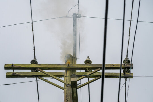 Smoke Rises from Top of Utility Pole after Lighting Strike in New Orleans, LA, USA