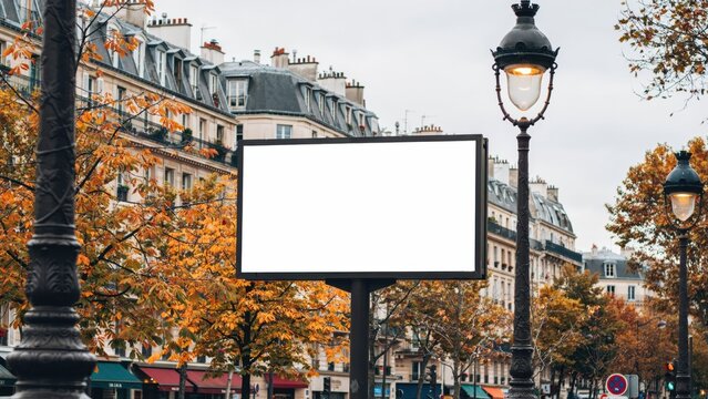Blank billboard mockup on a street in paris in autumn