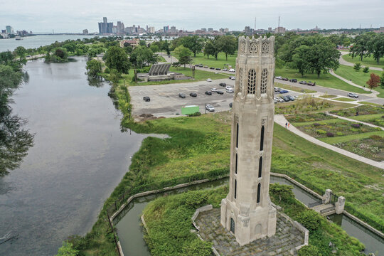 Aerial view of the Nancy Brown Peace Carillon tower on Belle Isle Park with the Detroit skyline and river in the background, Detroit, Michigan, United States.