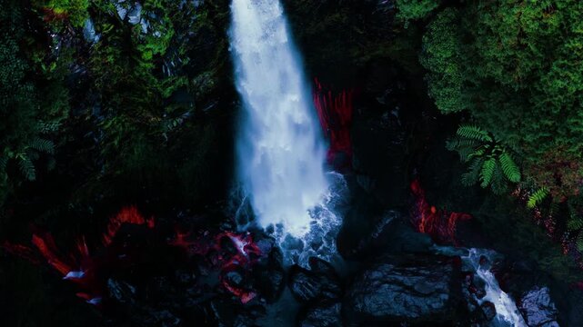 Cascata das Lombadas Waterfall Crashes Over Striking Reddish-orange Rocks On S&atilde;o Miguel Island In The Azores, Portugal. Aerial Ascending Shot