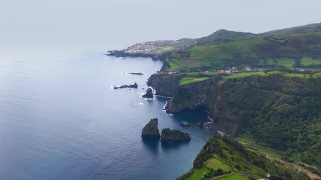 Rugged Coastline Overlooking Santa Cruz das Flores Town, Flores Island, Azores, Portugal. Aerial Shot