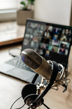 Home studio for podcast recording. Interior with microphone and laptop on table