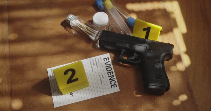 Top-down view of police evidence markers, forensic evidence and a pistol arranged within a staged cinematic crime investigation scene.