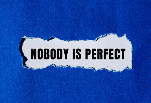 Nobody is Perfect message written on ripped torn paper background. Conceptual Nobody is Perfect symbol. Copy space.