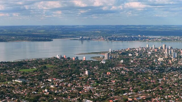 Aerial drone footage shows the twin border cities of Posadas and Encarnacion divided by the Parana River.