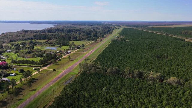 Aerial flight above National Countryside Route 12 Next to Paran&aacute; River Agricultural Village in Santa Tecla Corrientes Argentina