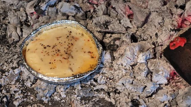 Close Up Argentine Provoleta Cheese Melting Charcoal Grill Asado Barbecue
