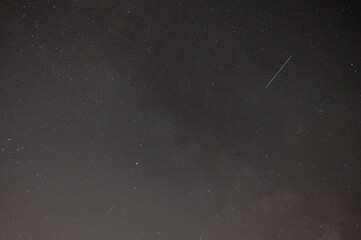 Starry Night Sky Background with Faint Meteor Trails and Deep Space Stars © montypeter