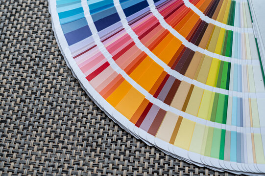 Color Swatch Palette Guide Fan Spread on Surface for Interior Design Paint Selection Concept