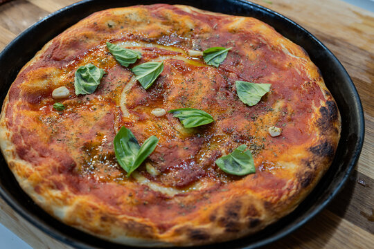 Garlic, oil, and oregano pizza, historically known as marinara pizza.