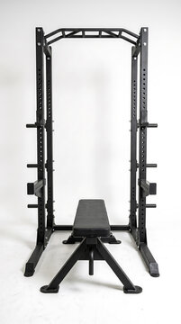Black steel power rack with weight bench for fitness training
