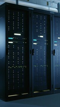 Shot of data center with multiple rows of full technology
