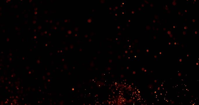 Ultra slow motion floating embers and glowing sparks on black background captured at 1000 FPS. Atmospheric fire particles drifting through darkness, ideal for cinematic overlays.
